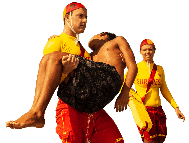 description of tLifesavers rescuing a boy from the surfhe image